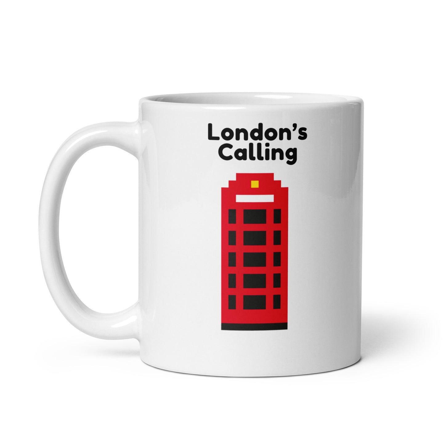 Glossy white ceramic mug featuring pixel art red telephone box and "London’s Calling" slogan, handle left