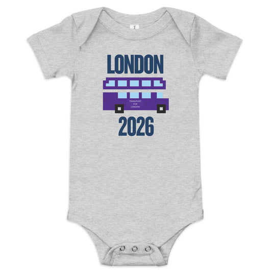 Gray baby onesie featuring pixelated purple London double-decker bus with 'London 2026' text in retro 8-bit style.