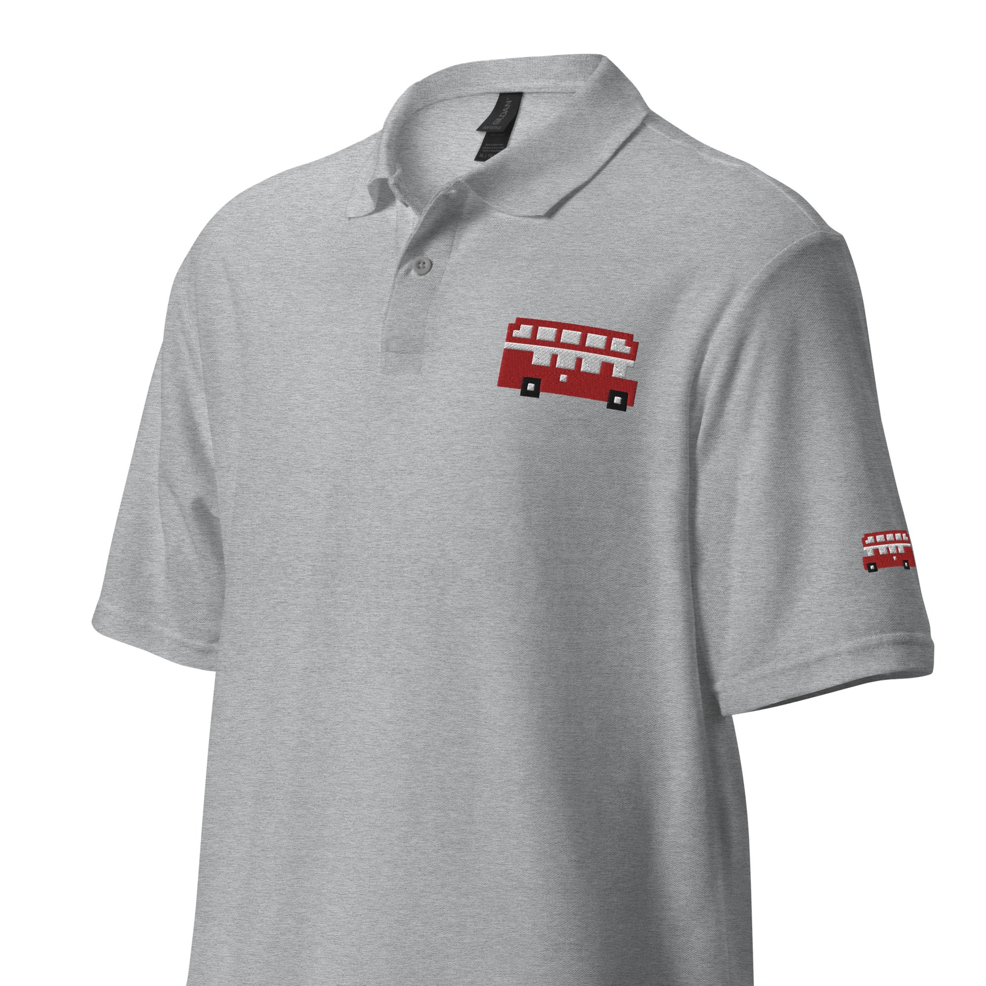 Festive gray polo shirt featuring a pixel art red London double-decker bus on the chest and sleeve, perfect as a London-themed Christmas gift. This unique shirt combines iconic British charm with a retro holiday style, making it an ideal Christmas present for London lovers and fans of classic British symbols. Great for Christmas gift ideas and holiday shopping with a London twist.